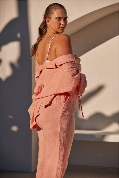 side profile of musk pink crepe lounge wear set worn by blonde model