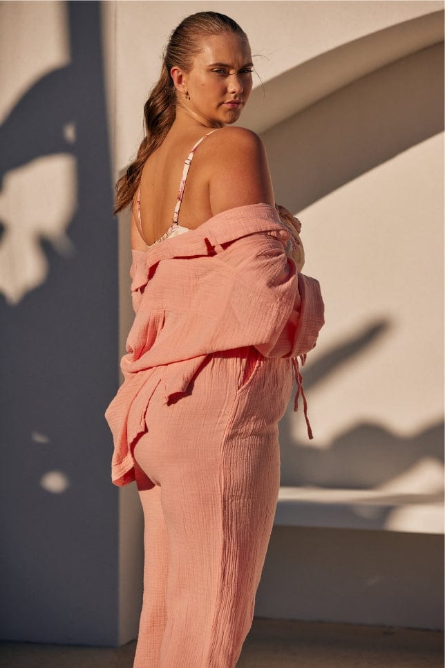 side profile of musk pink crepe lounge wear set worn by blonde model