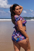 Back of model wearing floral navy based pant