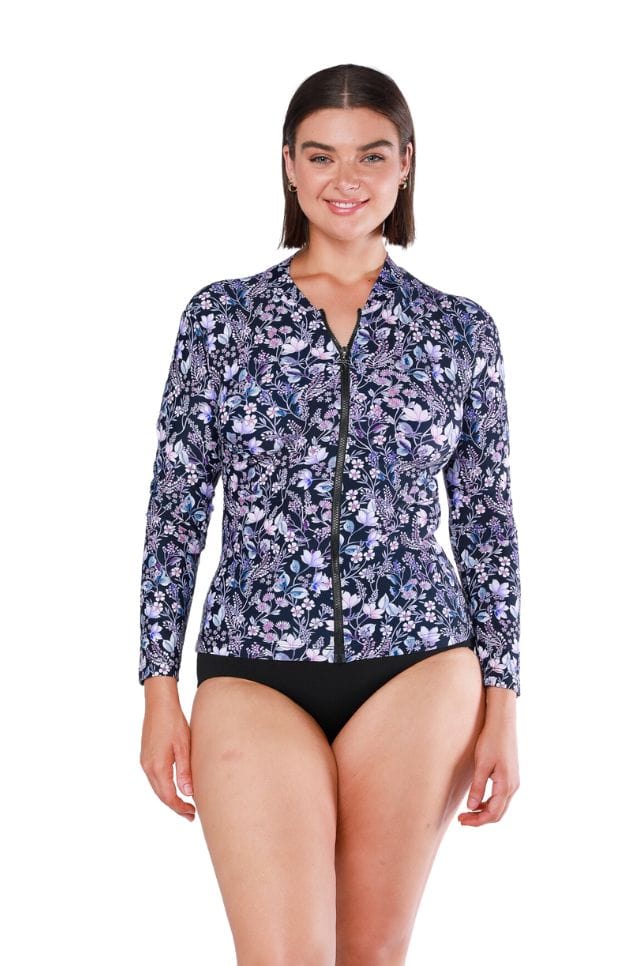 Plus size lady wearing long sleeve rashie with zip in purple and navy colour floral