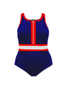A woman modeling a one-piece swimsuit with a navy blue base and red and white striped accents on the neckline and waist, photographed against a plain light gray studio background.