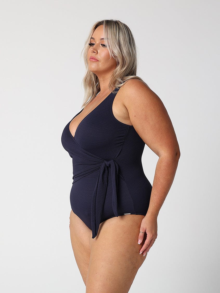 model showing side of navy textured one piece