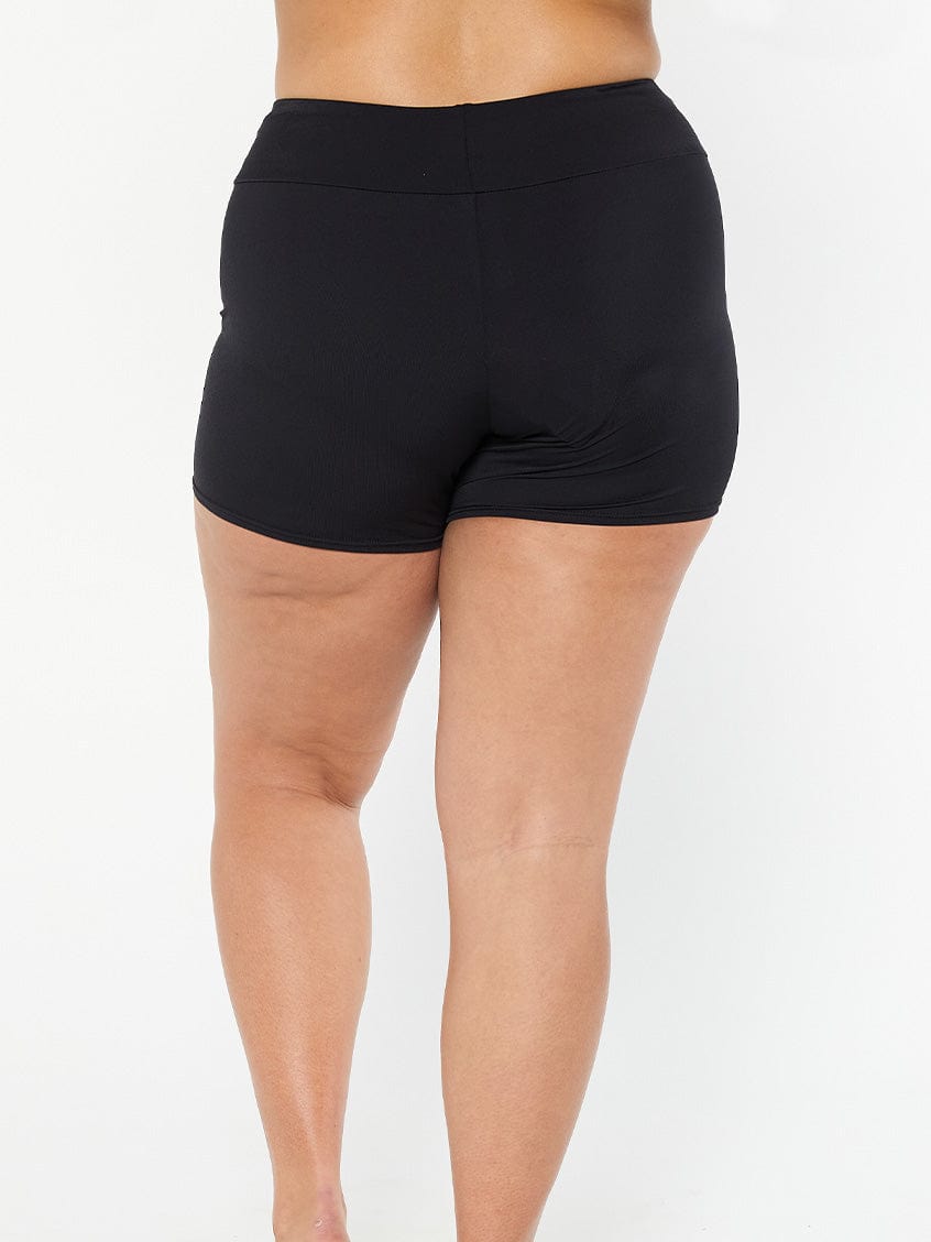 model showing full coverage back of black boyleg swim pant