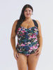 Woman in studio wearing a retro one piece with thick black adjustable straps in floral print