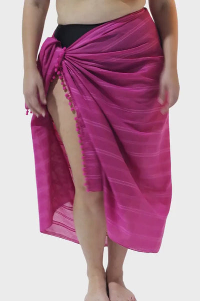 Video of model wearing bright pink beach coverup sarong for curvy women
