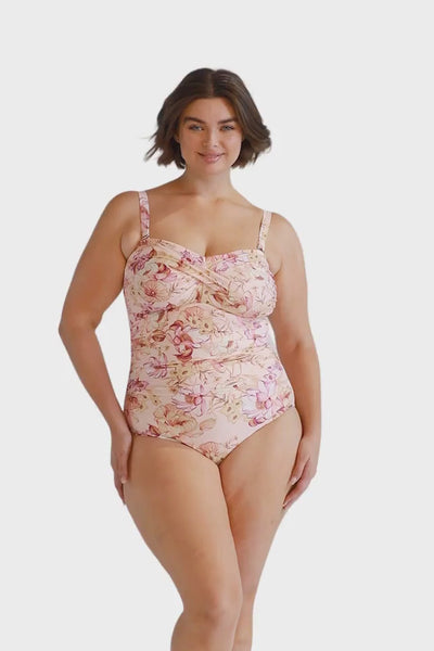 Brunette model wearing curve floral twist front swimsuit with removable straps Australia