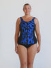 Blonde model in studio wearing a sleeveless one piece in chlorine resistant fabric