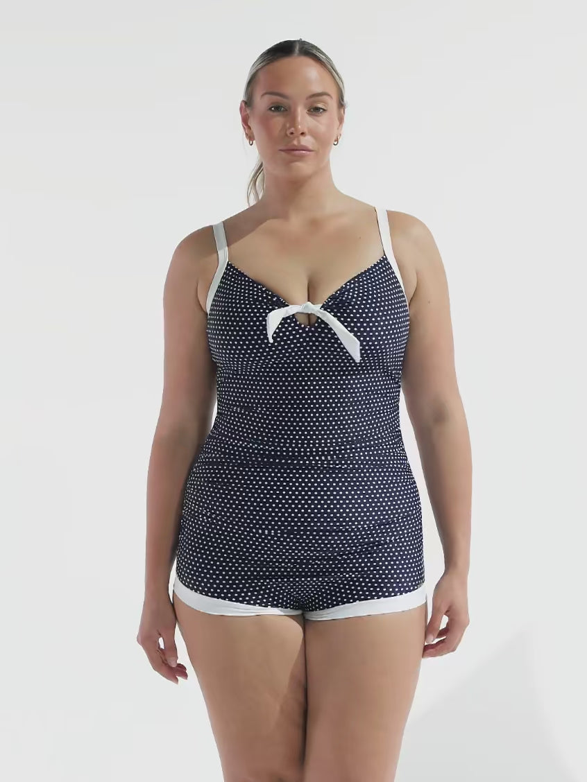 model wearing navy and white dots boyleg women's swimsuit