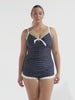 model wearing navy and white dots boyleg women's swimsuit