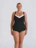 Blonde model in studio wearing underwire tankini top with white trim neckline