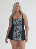 Curve woman wearing wide strap swim dress in paisley chlorine resistant fabric
