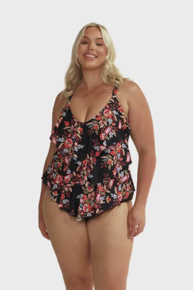 Video of model showing off floral tankini top with three tiered detail for curve women