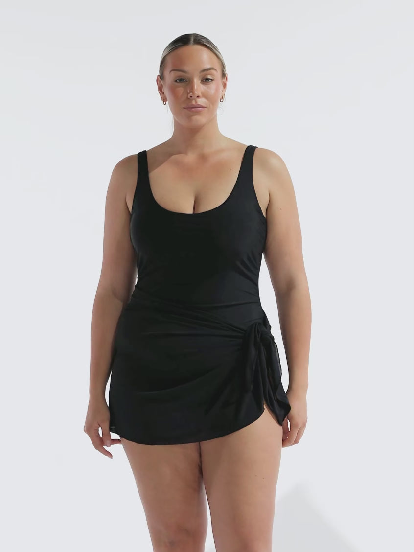 model wearing black mesh tie side skirt