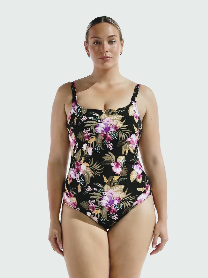 Blonde model in studio wearing a chlorine resistant floral tank one piece in chlorine resistant