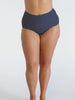 Woman wearing a navy white dots high waisted pant