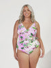 Video of plus size blonde model in studio wearing a crossover tie one pice with v neck in floral print