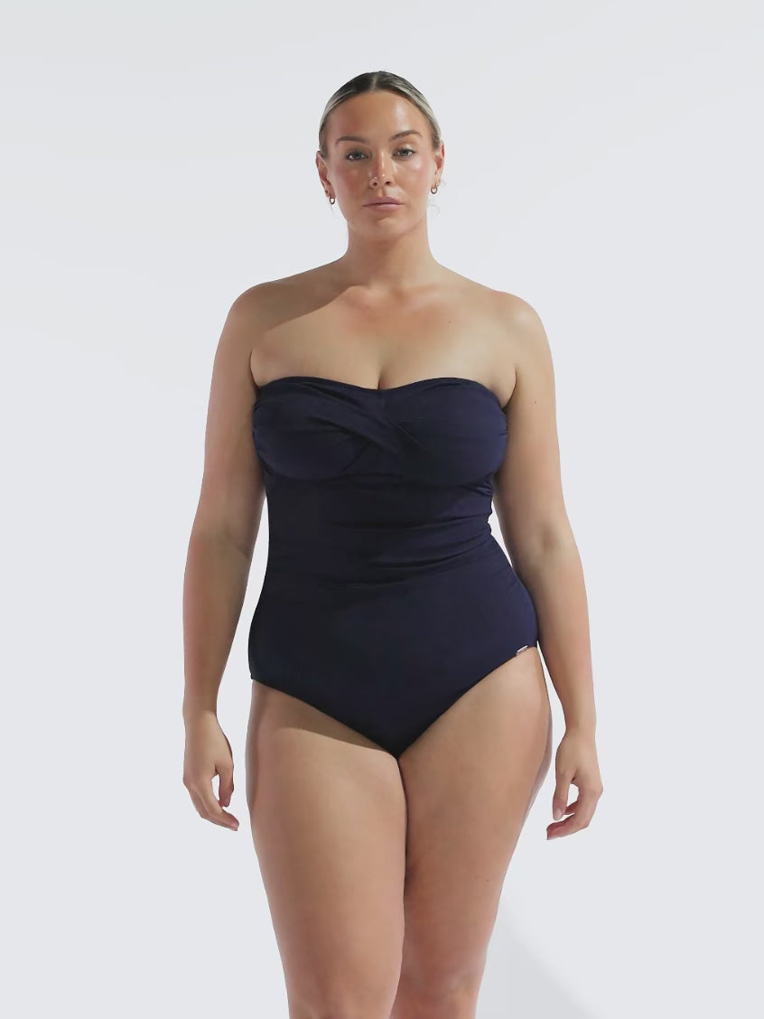 model wearing textured navy strapless swimsuit