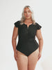 plus size model wears black high neck zip front one piece with cap sleeves