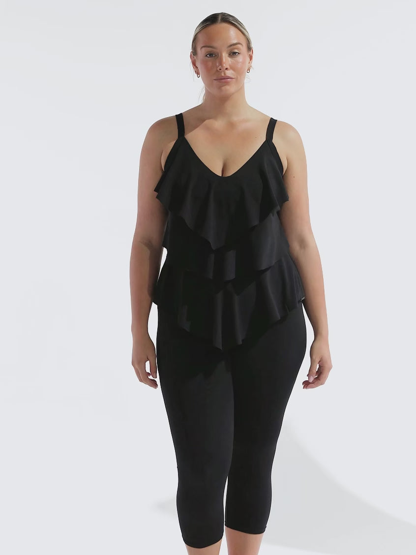model wearing black chlorine resistant swim tights with black tankini