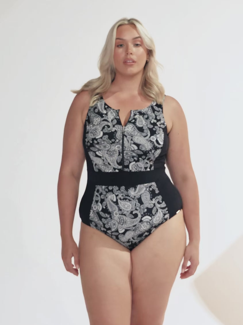 Video of model in studio wearing plus size one piece with zip front detail in pasiley chlorine resistant