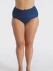 Curve model in studio wearing high waisted navy pant