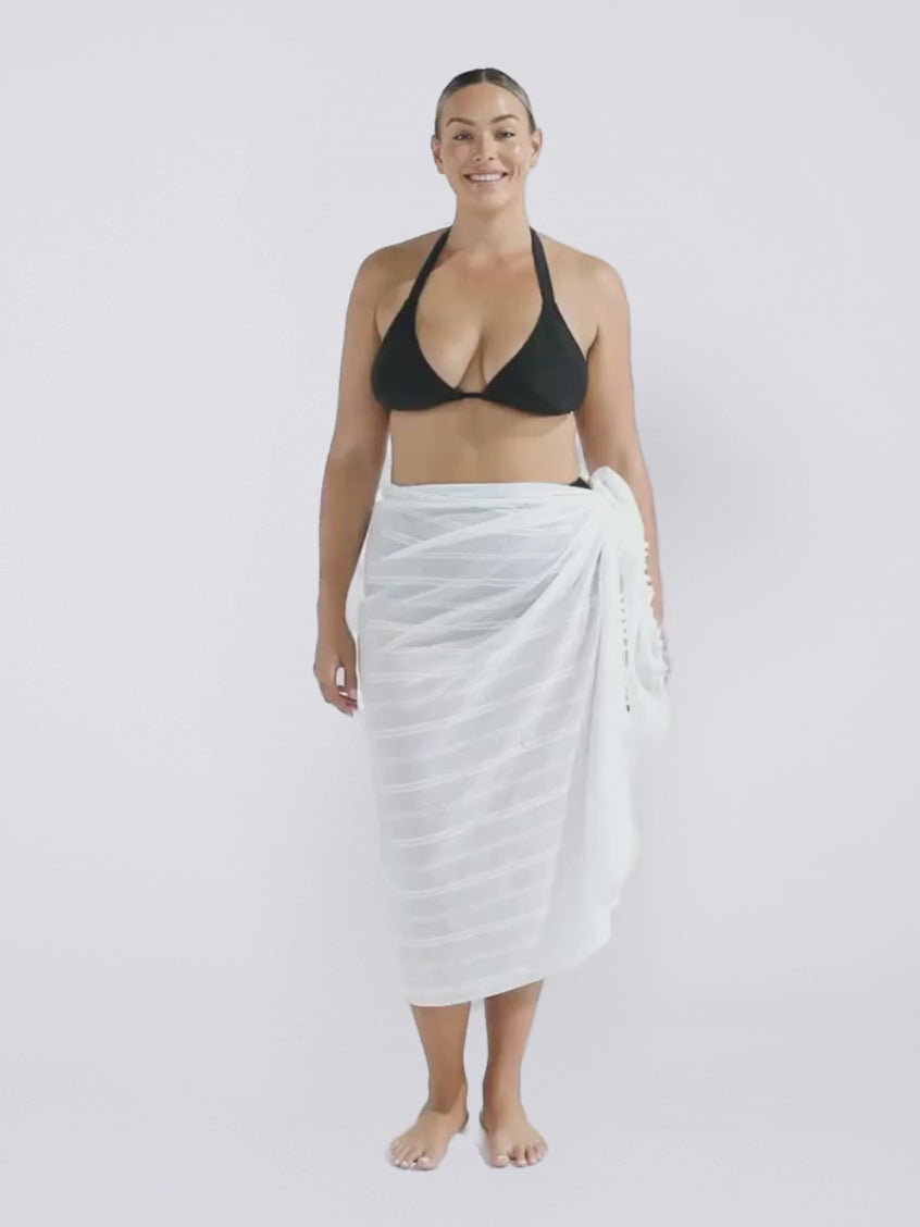 Blonde model in studio wearing a white cotton sarong in white for women