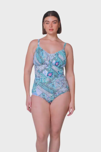 Brunette model wearing light blue patchwork underwire one piece swimsuit