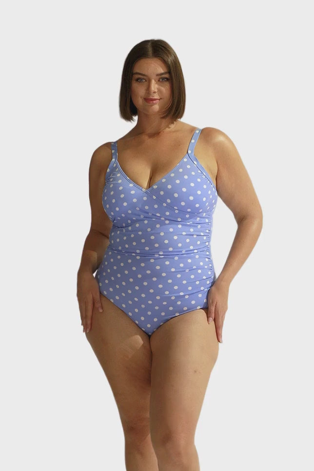 Curve model wearing crossover retro blue and white polka dot one piece with underwire