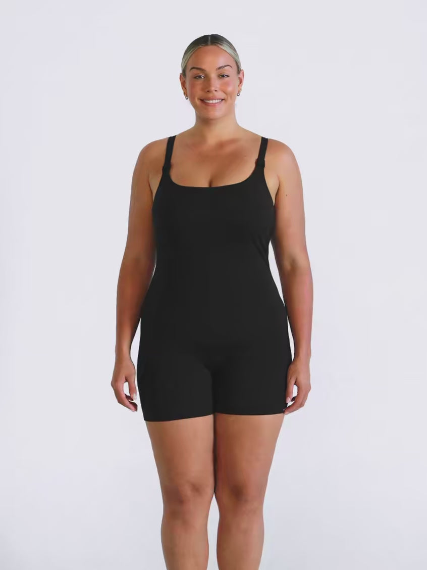 Blonde model in studio wearing a boyleg one piece with singlet straps
