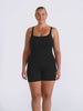 Blonde model in studio wearing a boyleg one piece with singlet straps