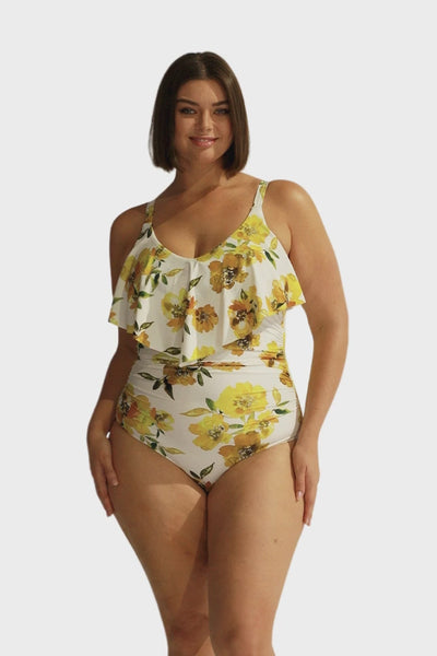 Brunette model wearing v neck plus size one piece with ruffle 