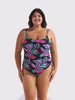 Model in studio wearing a scoop one piece with scoop back in floral tropical leaf print