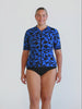 Blonde model in studio wearing a short sleeve rash vest in chlorine resistant