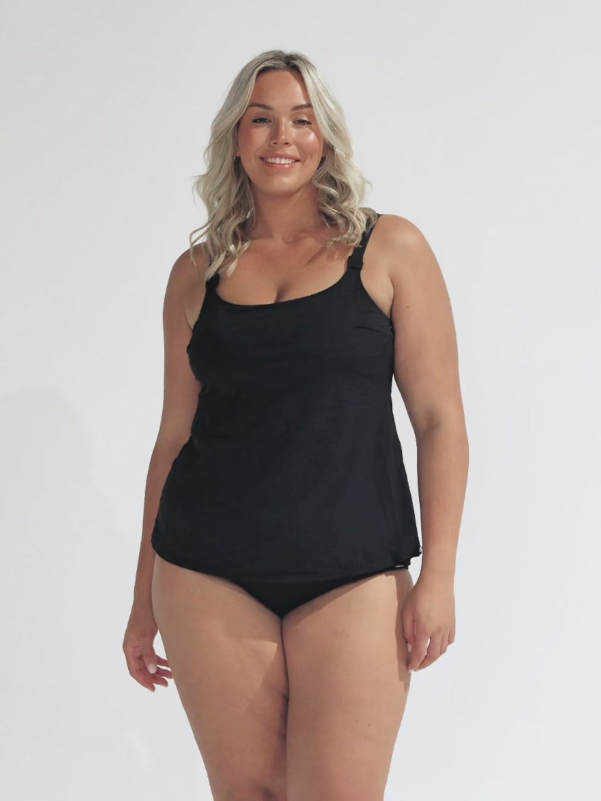 model wearing plain black tank tankini top