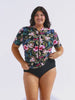 Model in studio wearing a floral short sleeeve rashie with full zip front detail