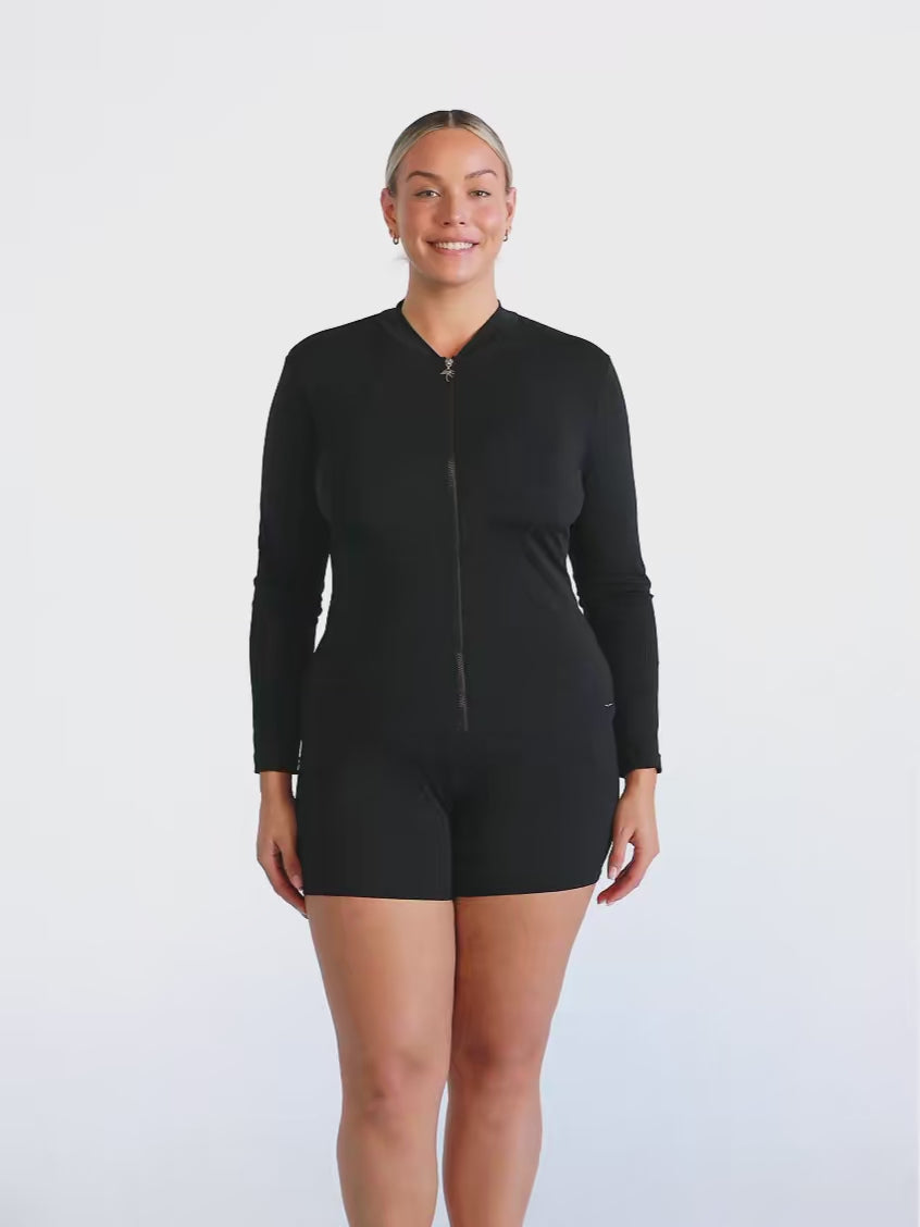 Model in studio wearing a long sleeve chlorine resistant rash vest