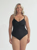 Blonde model wearing black criss cross one piece