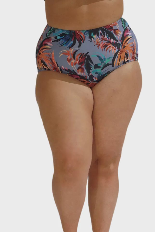 Video of model wearing high waisted flattering plus size swim pants in grey blue floral print