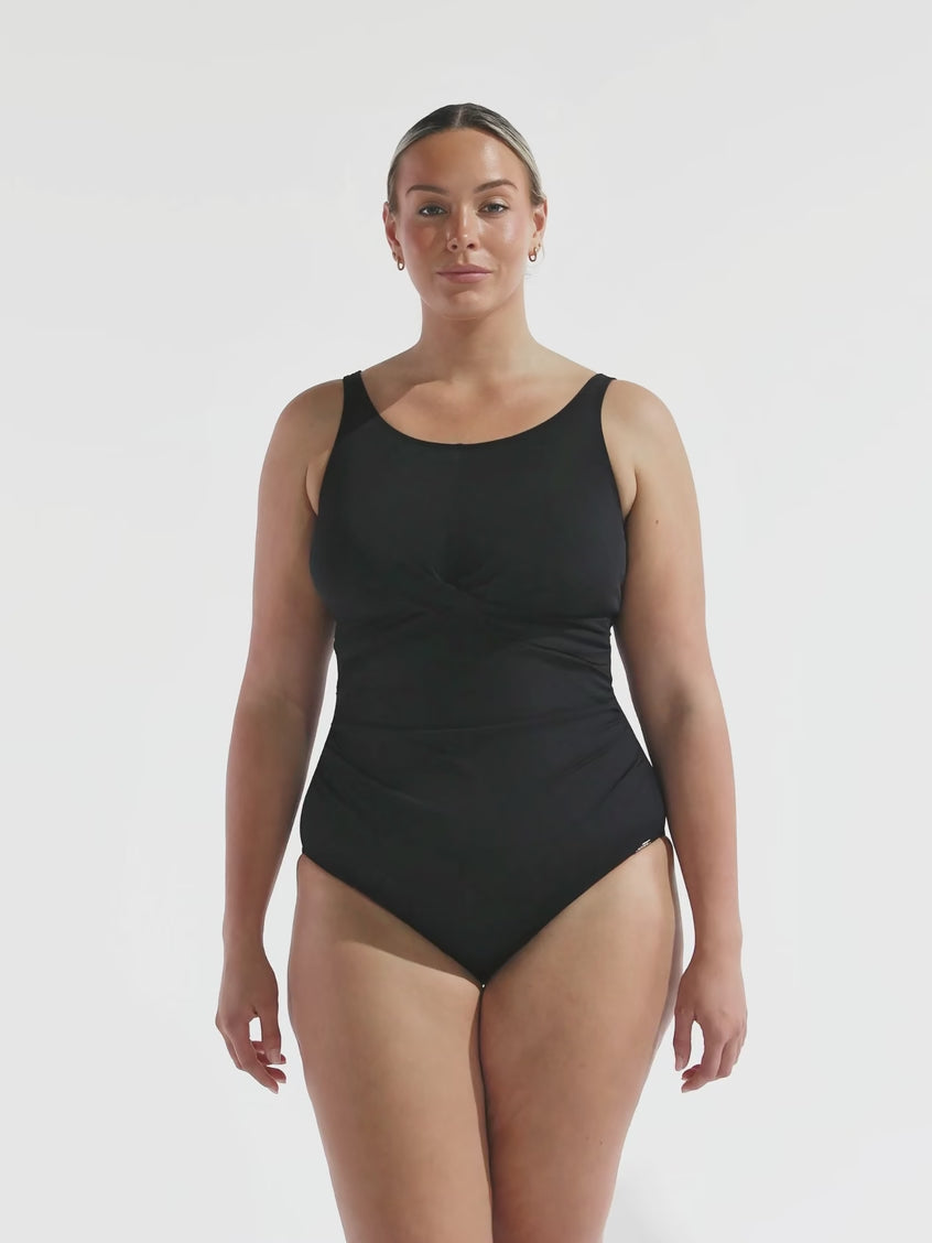 model wearing black chlorine resistant high neck one piece