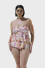 Curve brunette model wearing peach ruffle tankini in tropical floral print