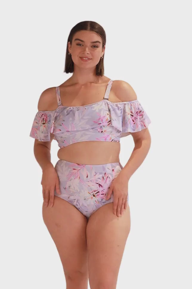 Video of woman wearing a plus size high waisted bikini bottom in lilac floral print