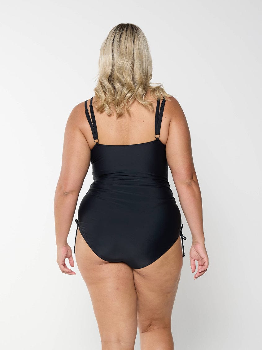 model showing back of side tied women's black one piece