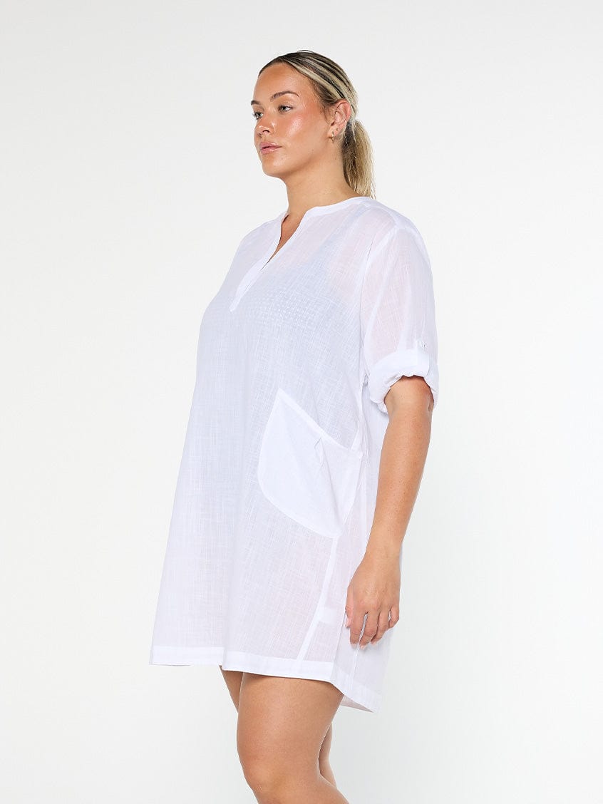 model showing side of white over shirt beach dress