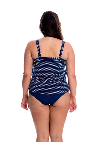 Model showing back of navy and white dots tankini top