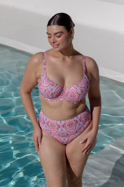 Woman wearing high waisted amalfi pink bikini bottom