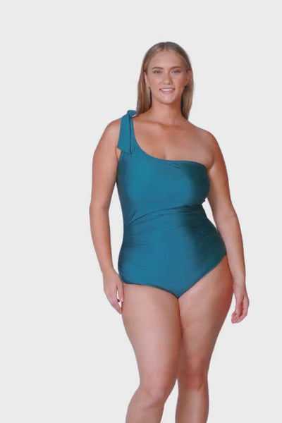 blonde plus size model wearing metallic deep teal with tie up one piece detailing