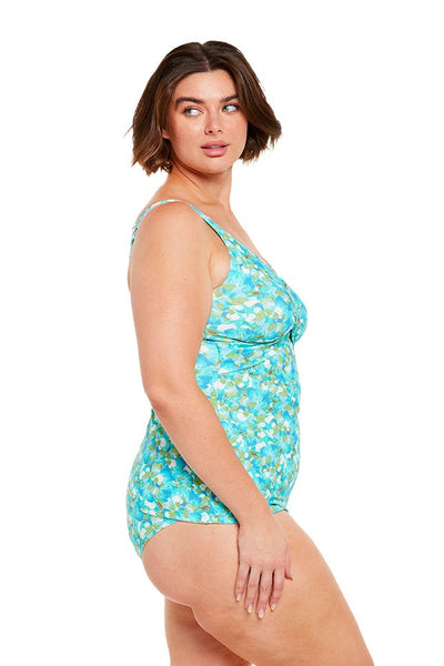 brunette women wears blue v neck crossover tankini top