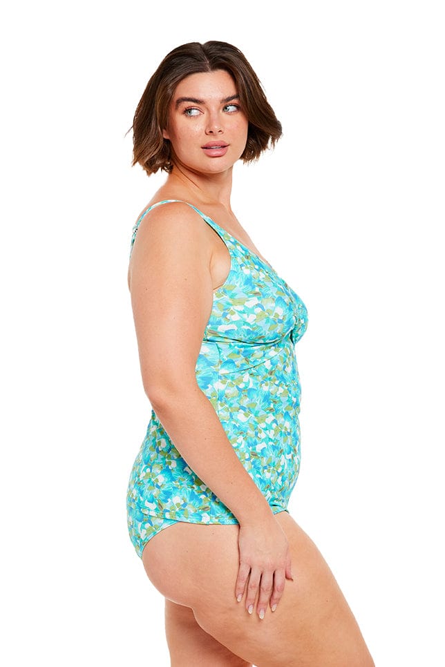 brunette women wears blue v neck crossover tankini top