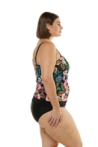 Curve model wearing women's tankini swimsuit with black high waisted pant