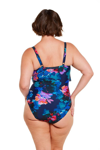 brunette size 16 model wears flattering blue navy floral one piece 